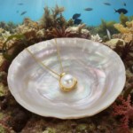 Smykke i 14kt gull med perle - bur210928